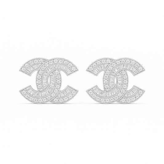 Diamond-studded Chanel earrings on a white background