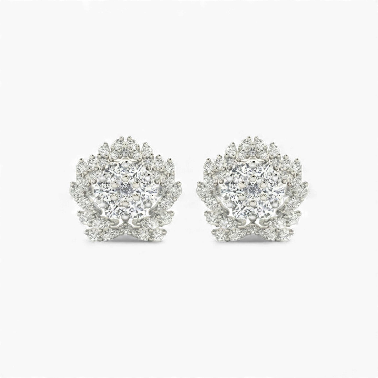 Pair of silver earrings with clear gemstones on a white background