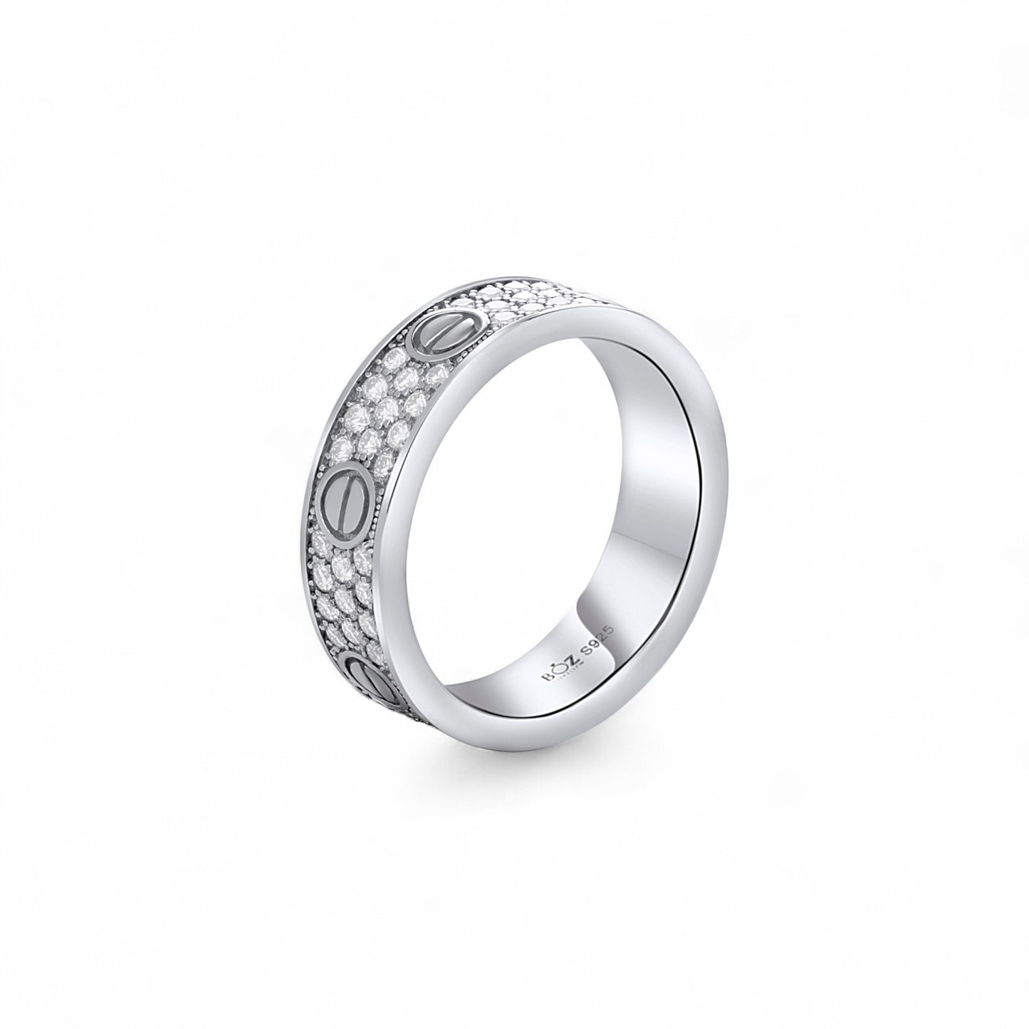 Silver ring with engraved design on a white background