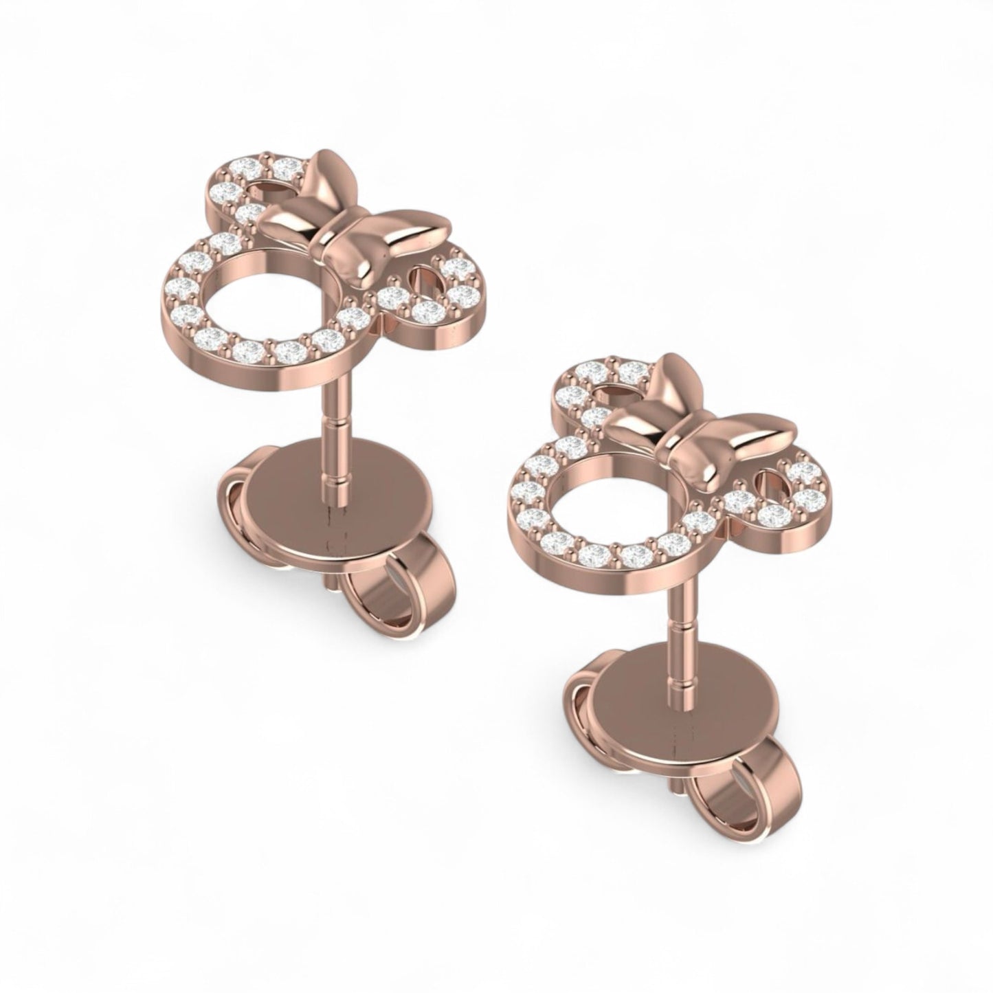 Rose gold earrings with star designs and clear gemstones on a white background