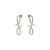Pair of gold and silver earrings on a white background