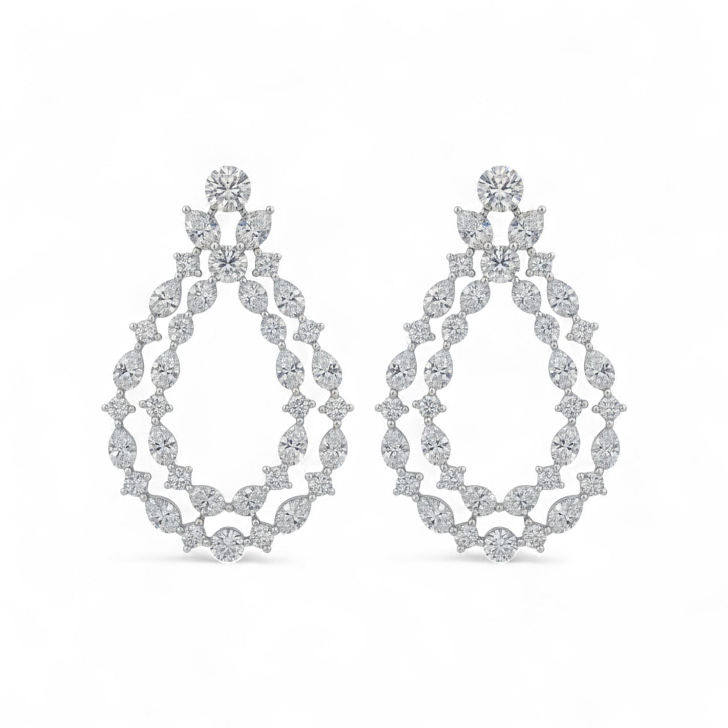 Pair of diamond earrings on a white background