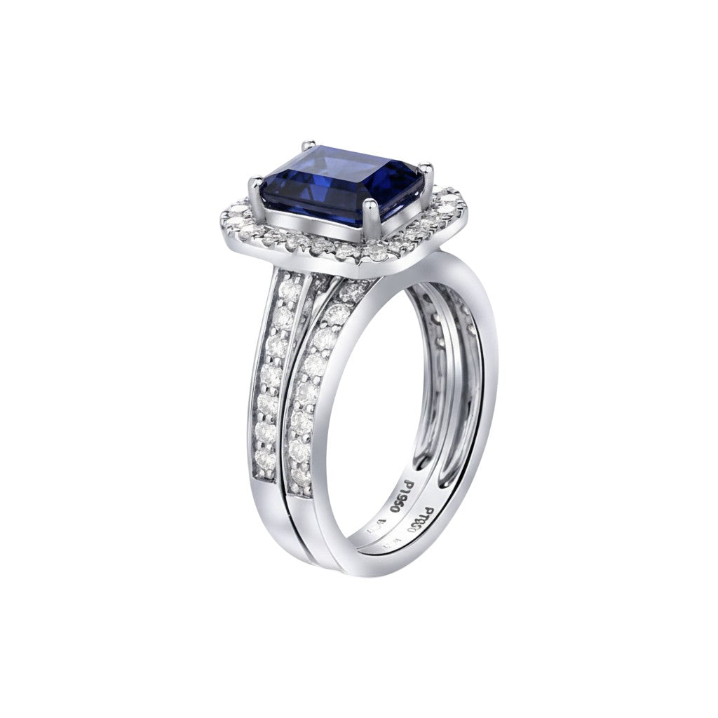 Silver ring with a blue gemstone and diamond accents on a white background