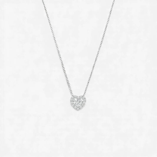 Heart-shaped diamond necklace on a light gray background