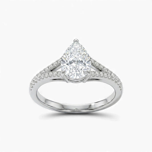 Diamond ring with a pear-shaped center stone on a white background