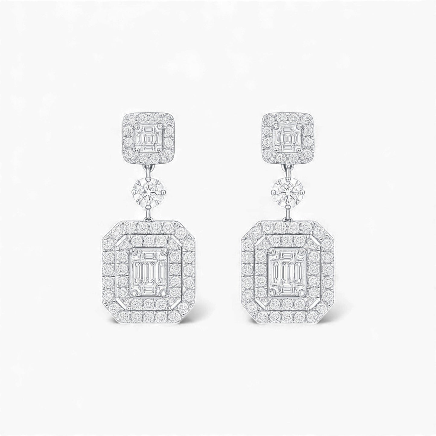 Pair of diamond earrings on a white background