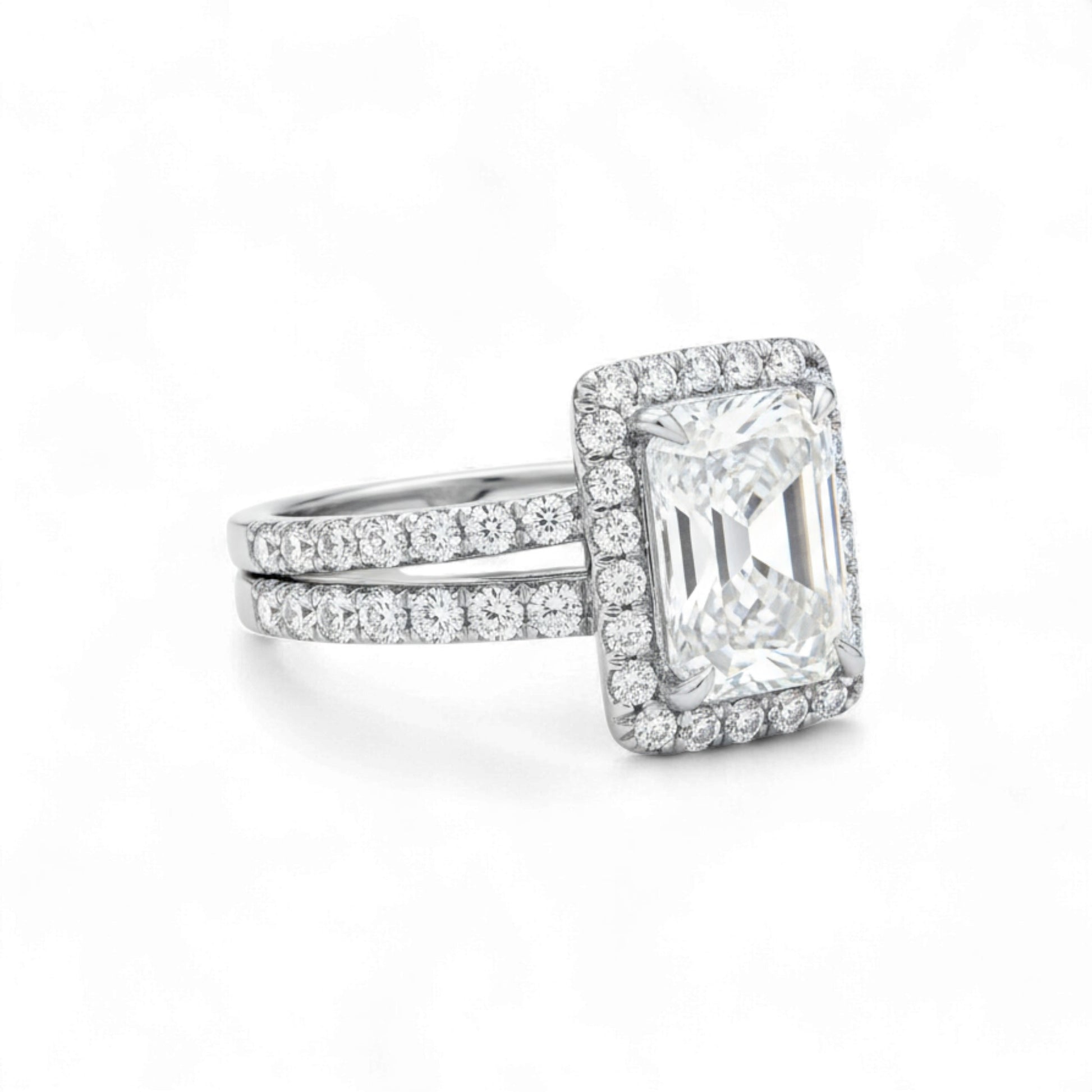 Diamond ring with a rectangular stone on a white background