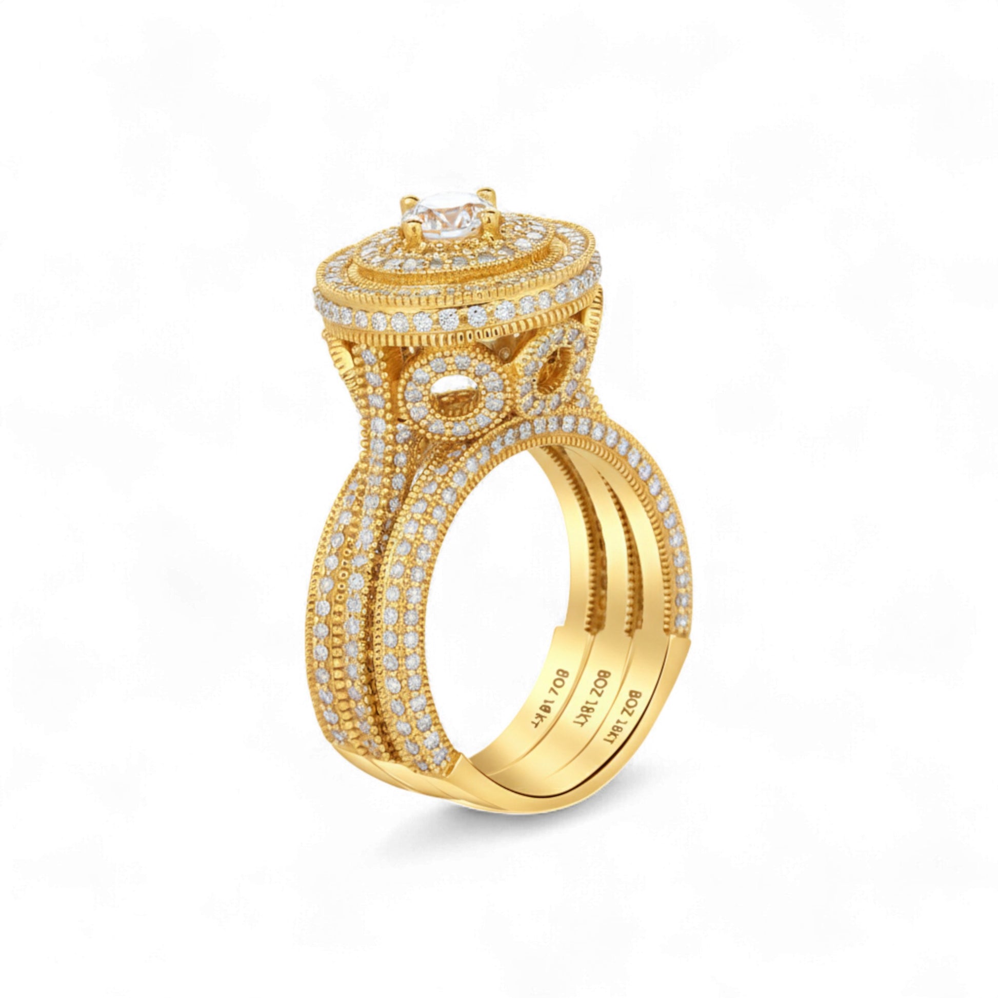 Gold ring with diamond accents on a white background