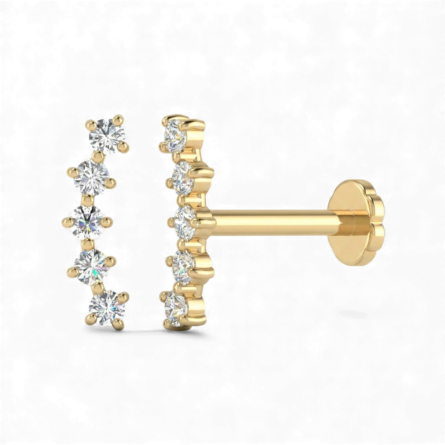 Gold earrings with diamond-like stones on a white background