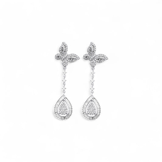 Pair of silver earrings with teardrop-shaped pendants on a white background